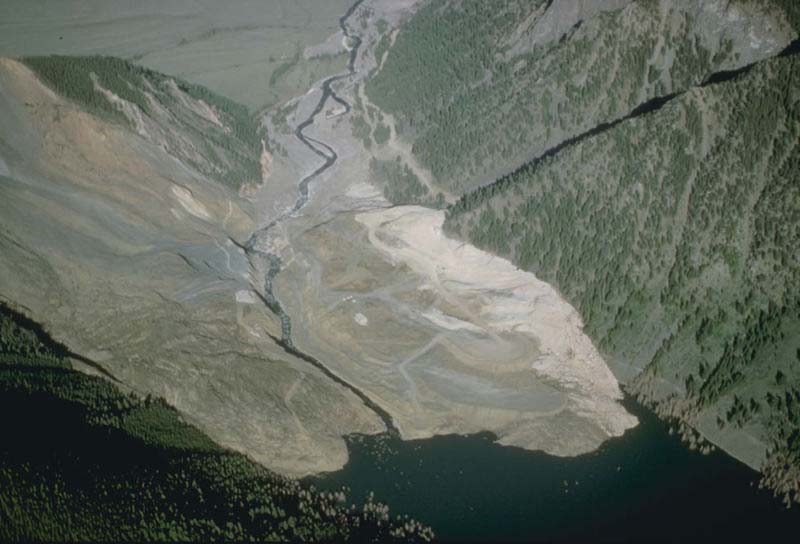 This dramatic photo shows the impact of a massive landslide that has slid much of the way down a large hill.