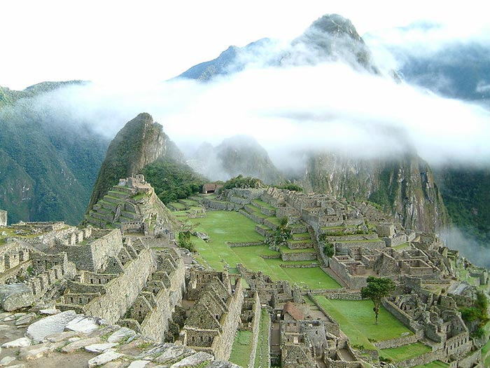 Machu Picchu is a famous Inca site found deep in the mountains of Peru. Sometimes known as ‘The Lost City of the Incas’, it was largely unknown by the outside world until it was brought to international attention in 1911 by Hiram Bingham, an American historian. It is now a popular tourist destination with many people trekking through the mountains to reach the famous landmark every year. This photo shows the famous location of Mach Picchu sitting amongst white clouds.